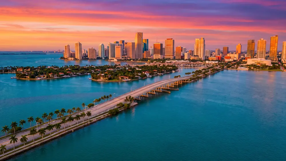 The Venetian Causeway crossing Biscayne Bay at golden hour.